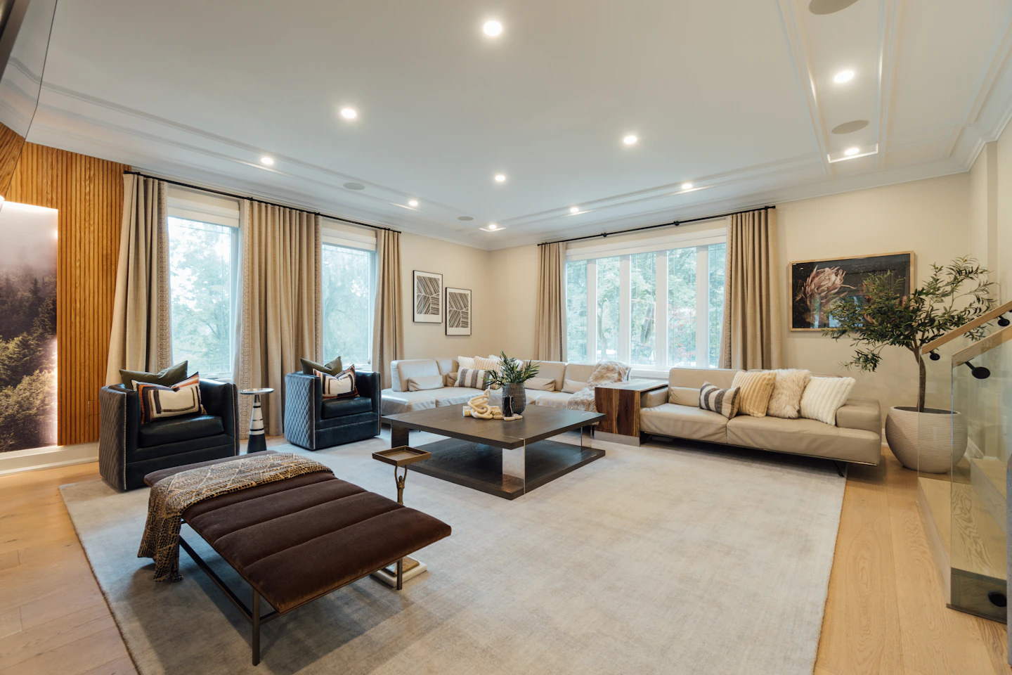 A welcoming living room with soft neutral sofas, natural light and a carefully arranged coffee table